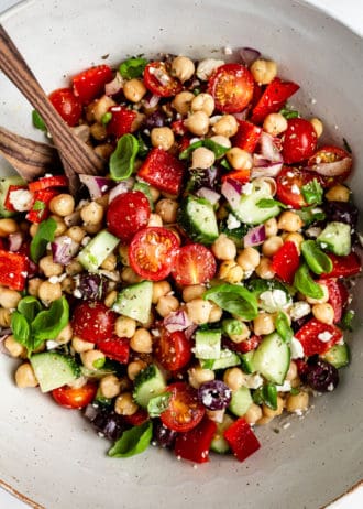 Mediterranean Chickpea Salad tossed in a bowl