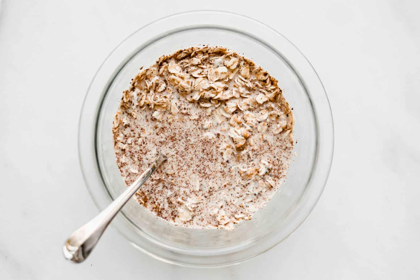 oats and almond milk in a mixing bowl