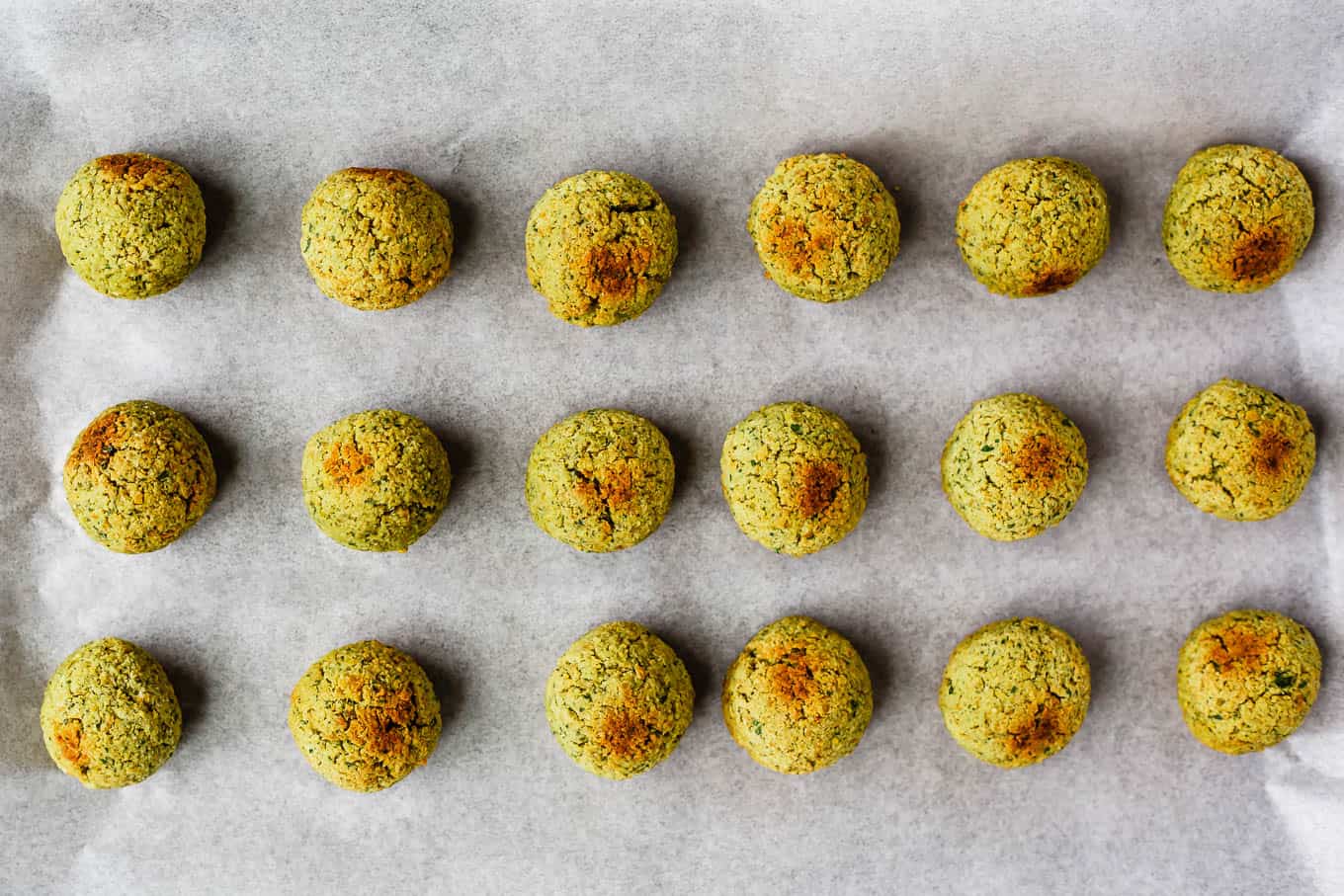 baked falafel balls on a baking sheet
