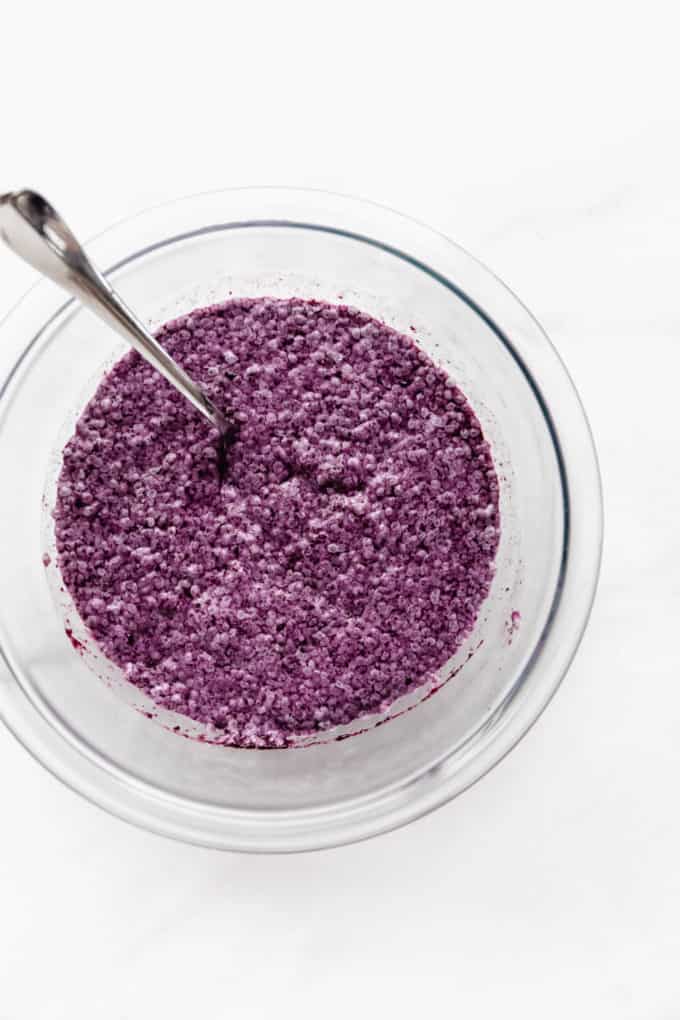 blueberry chia pudding in a clear mixing bowl