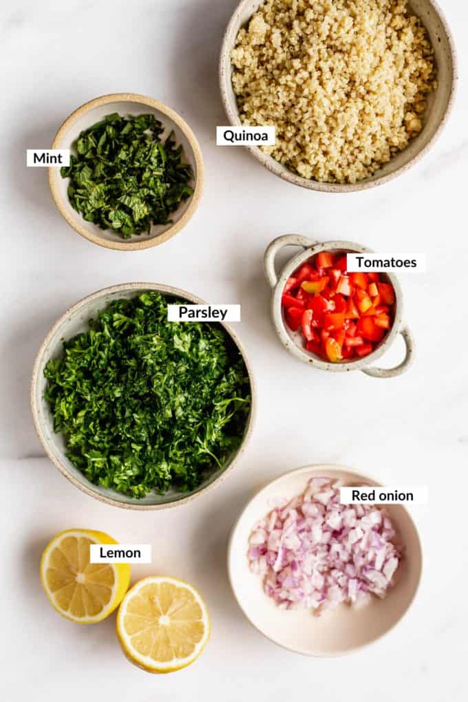 A flat lay of ingredients for a quinoa tabbouleh salad