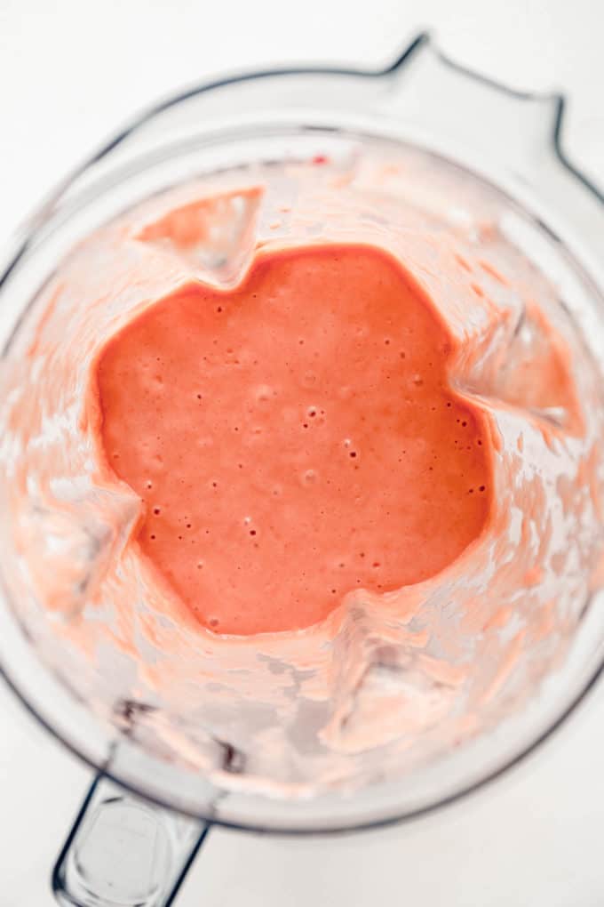 strawberry mango smoothie inside a blender container