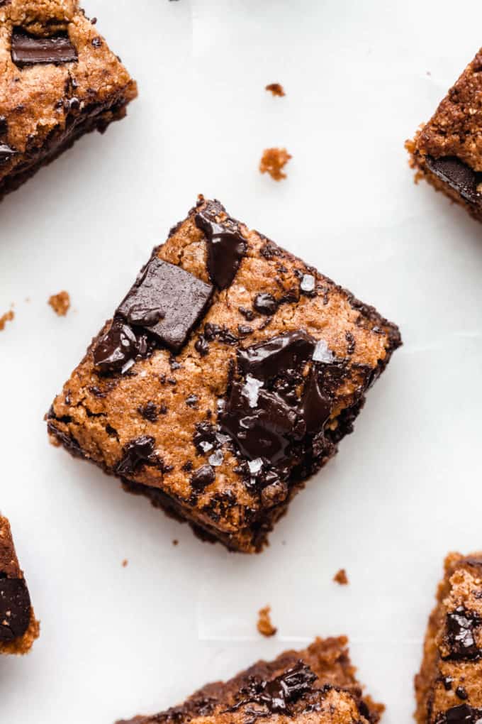 An almond butter blondie topped with chocolate chunks