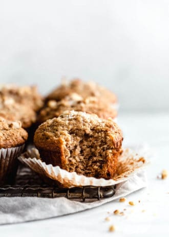 A banana nut muffin with a bite taken out of it