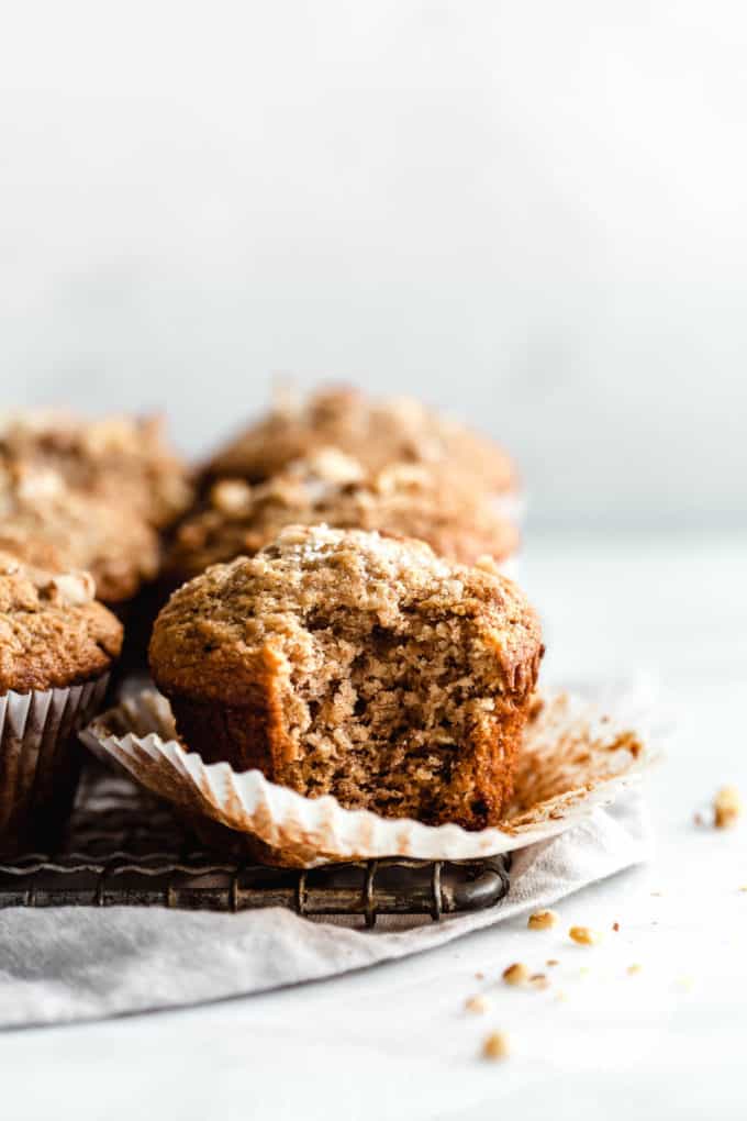 A banana nut muffin with a bite taken out of it