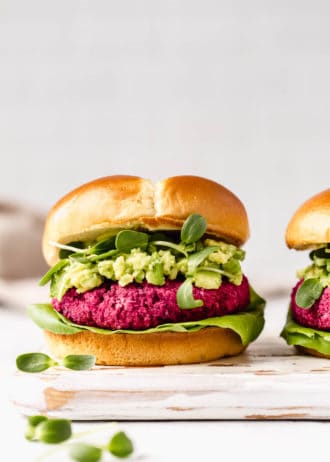 beet burgers on a white wooden serving board