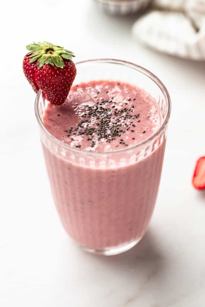 A strawberry chia seed smoothie in a glass