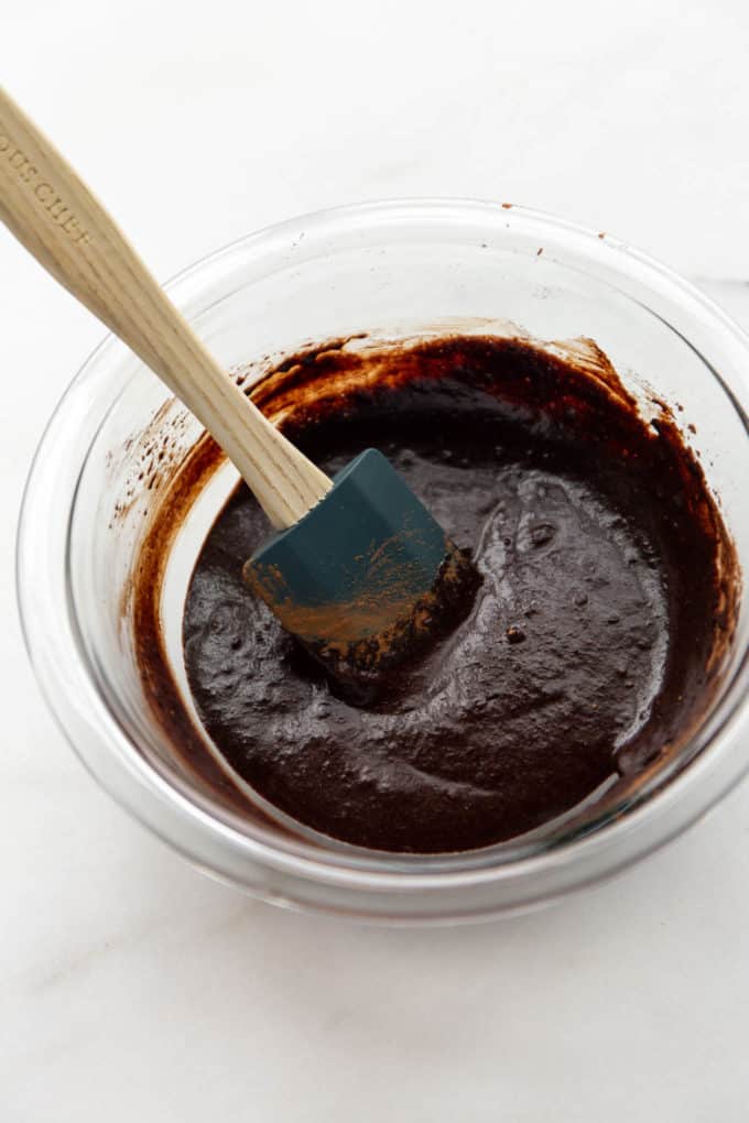 melted coconut oil, cocoa and maple syrup in a mixing bowl