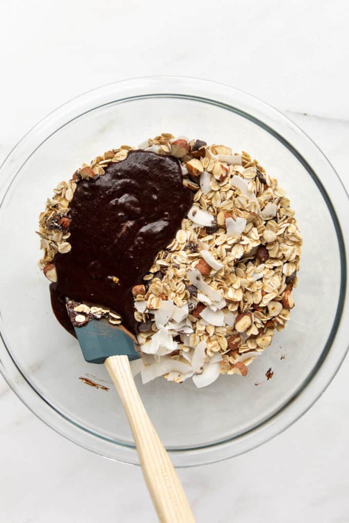 oats, coconut and chocolate in a mixing bowl