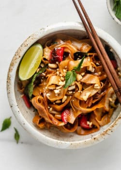 A bowl of Thai drunken noodles with chopsticks