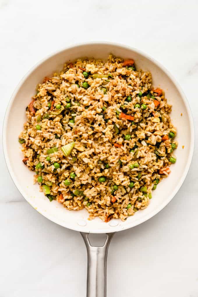 A white pan on a marble board with vegan fried rice