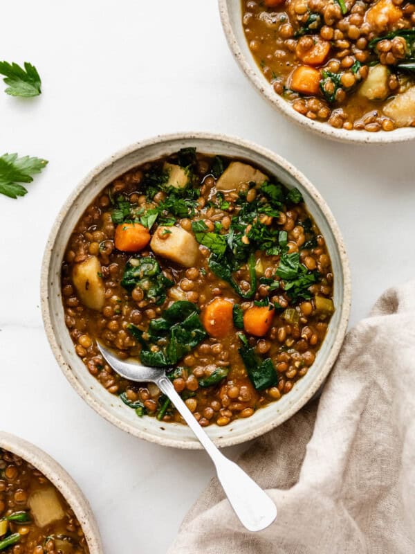 bowls of lentil stew on a white counter
