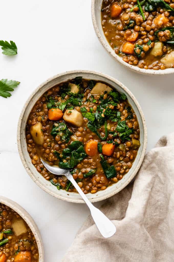 bowls of lentil stew on a white counter