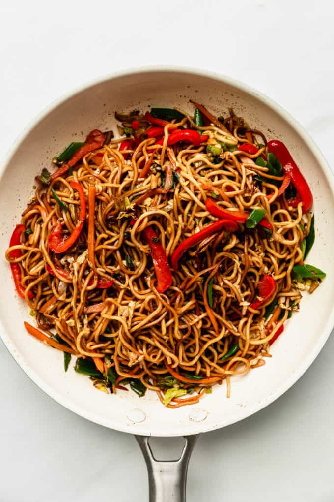 vegan chow mein in a white pan