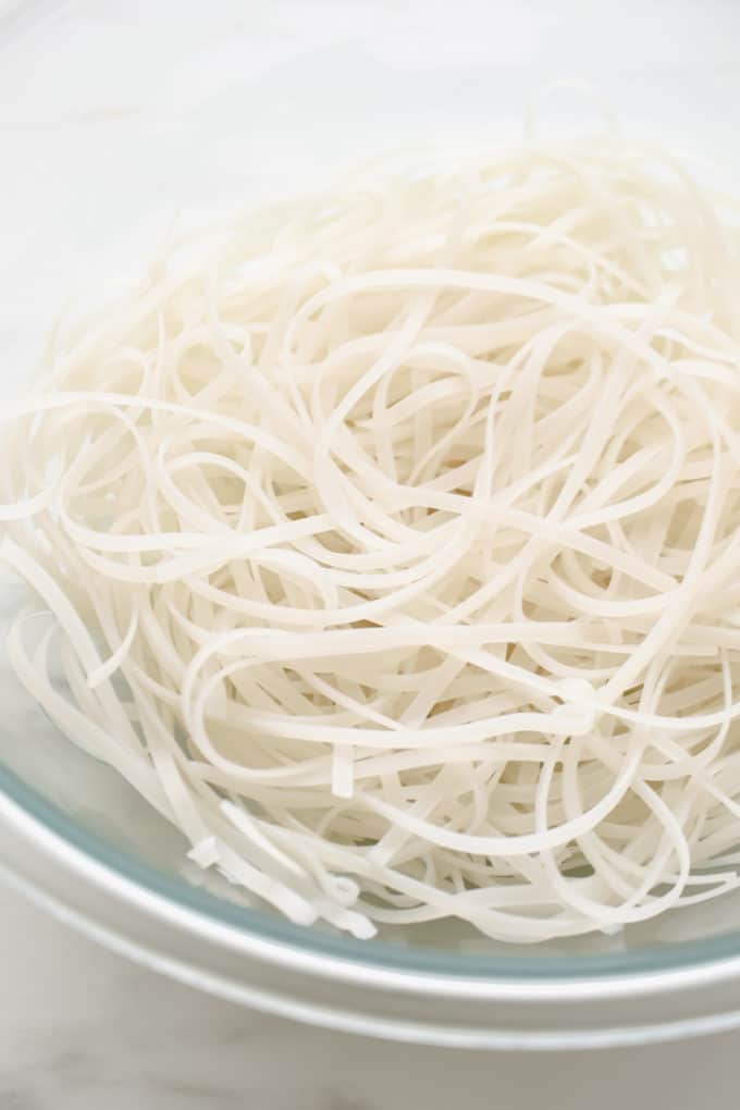 Cooked rice noodles in a clear bowl