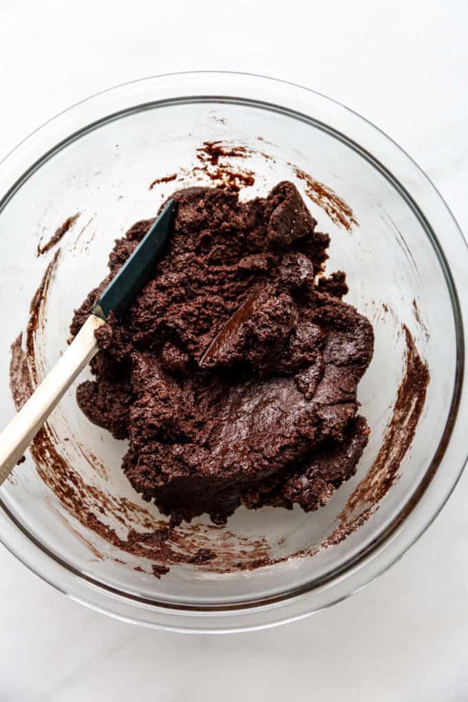 vegan brownie batter in a clear mixing bowl