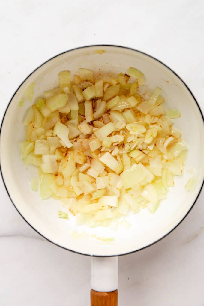 Onions and garlic in a white pot