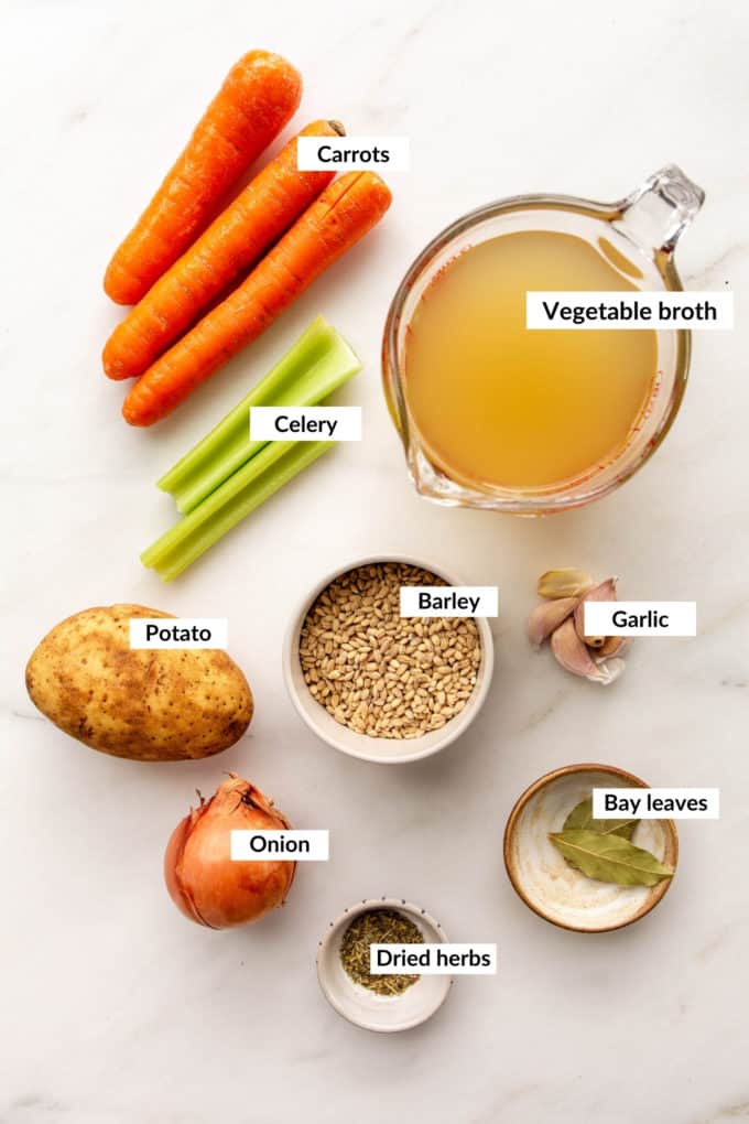 A flat lay of ingredients for vegetable barley soup
