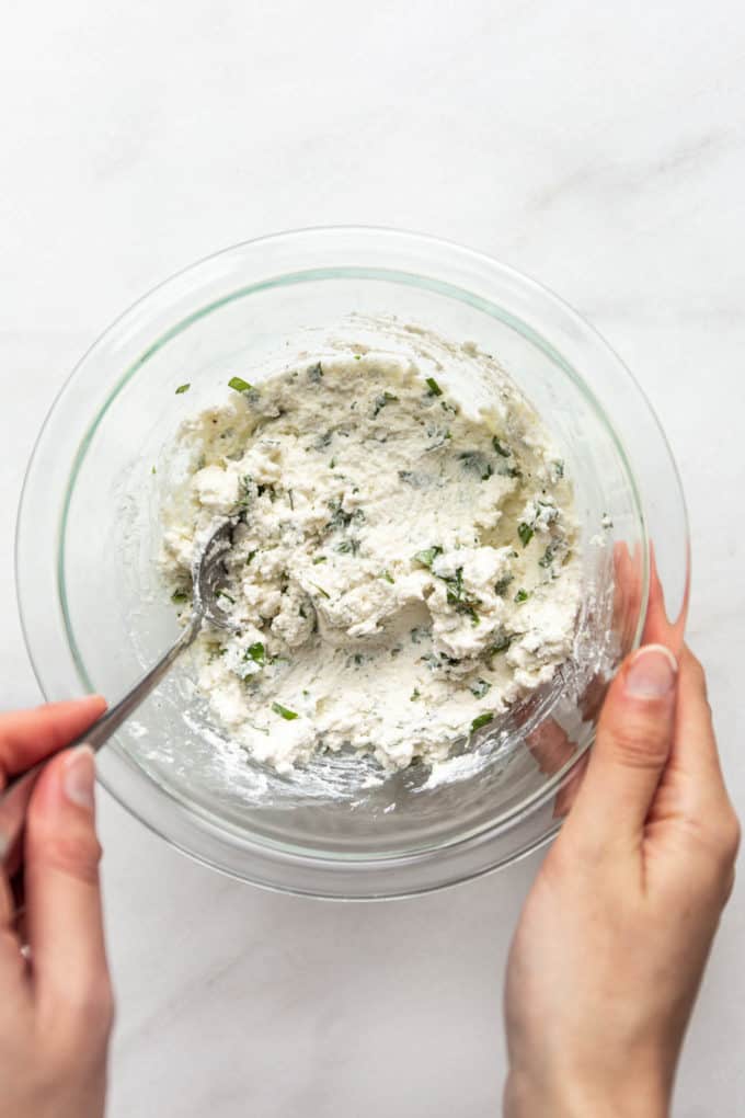 ricotta filling mixed up in a clear bowl