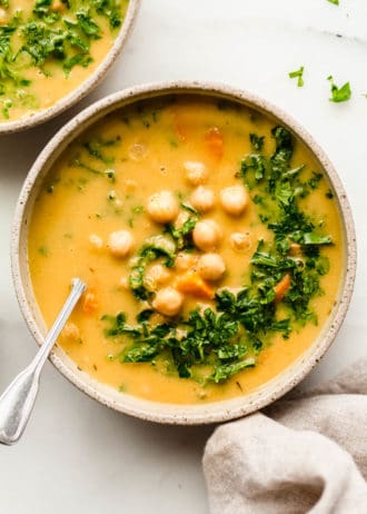 Chickpea soup in a bowl topped with parsley