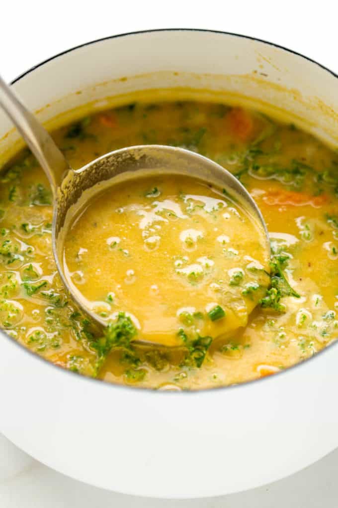 A ladel scooping chickpea soup