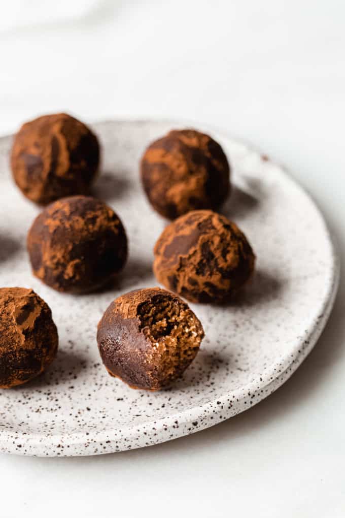 Gingerbread truffles on a white speckled plate