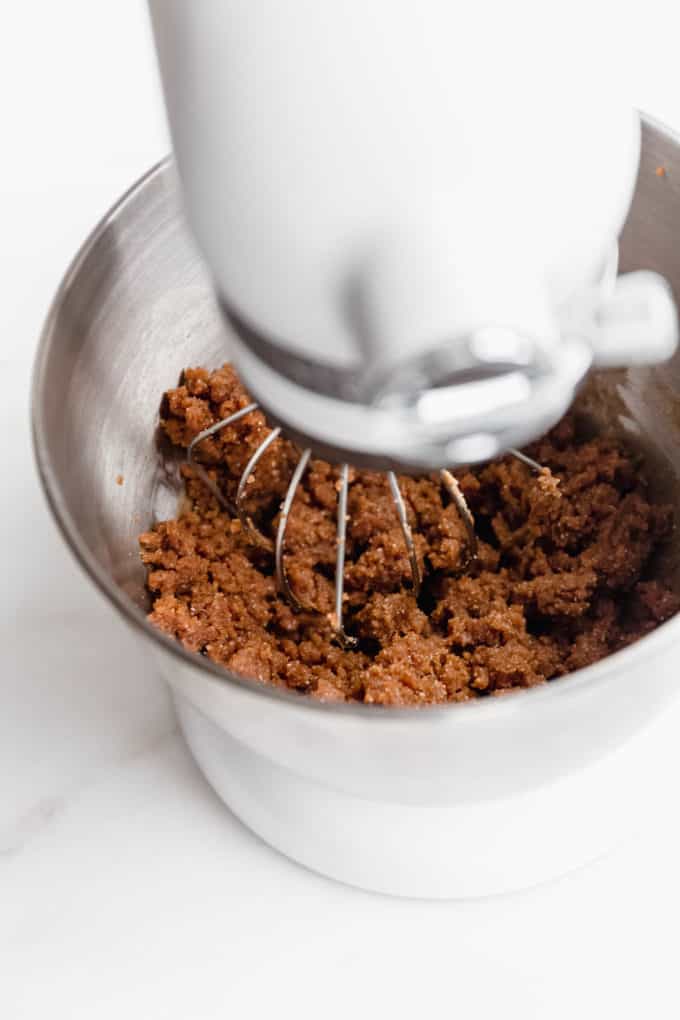 a stand mixer with peanut butter cookie dough in it