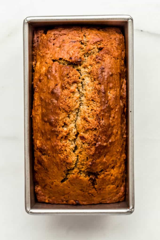A baked banana bread in a loaf pan