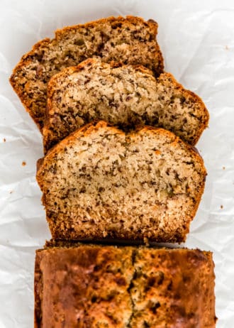 Slices of vegan banana bread on parchment paper