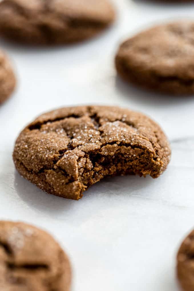 A ginger molasses cookie on a marble board