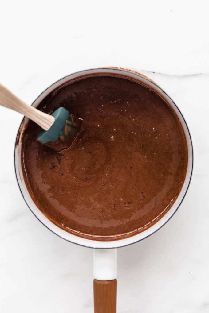 melted chocolate, coconut oil and almond butter in a white pot