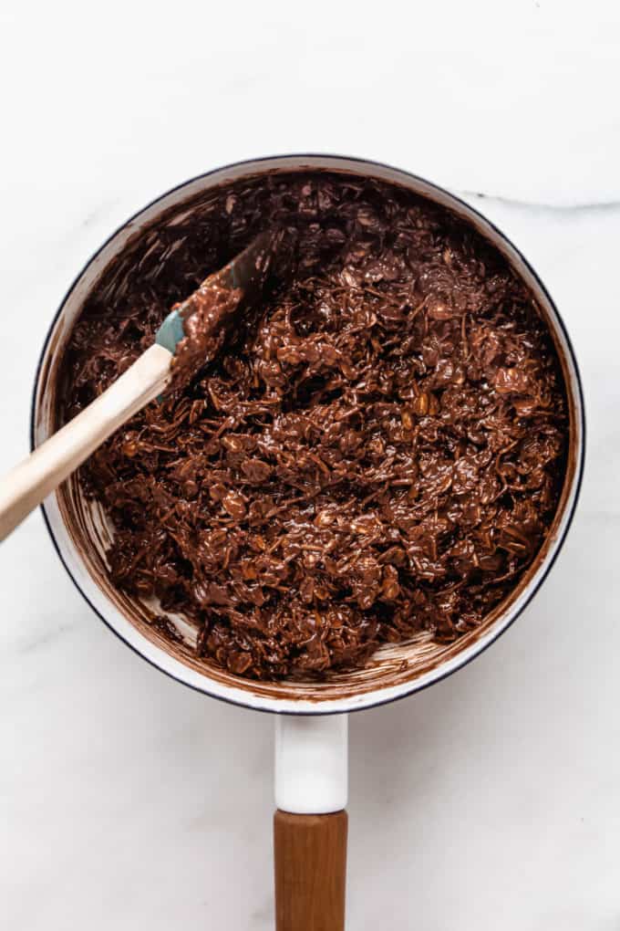 chocolate coconut bars batter in a white pot