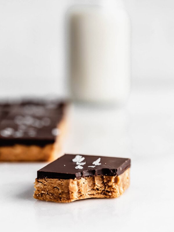 a peanut butter protein bar with a bite taken out of it