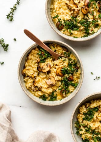 three bowls of vegan mushroom risotto