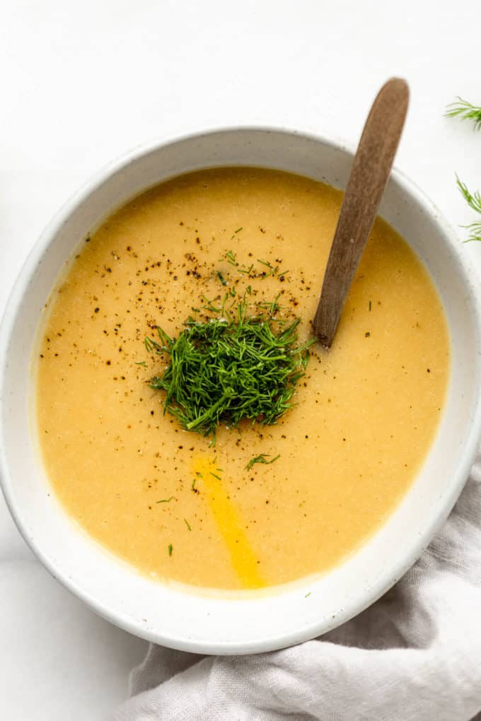 vegan potato soup in a bowl topped with dill