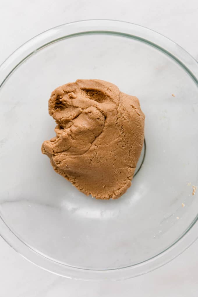 almond flour and cashew butter dough in a clear mixing bowl