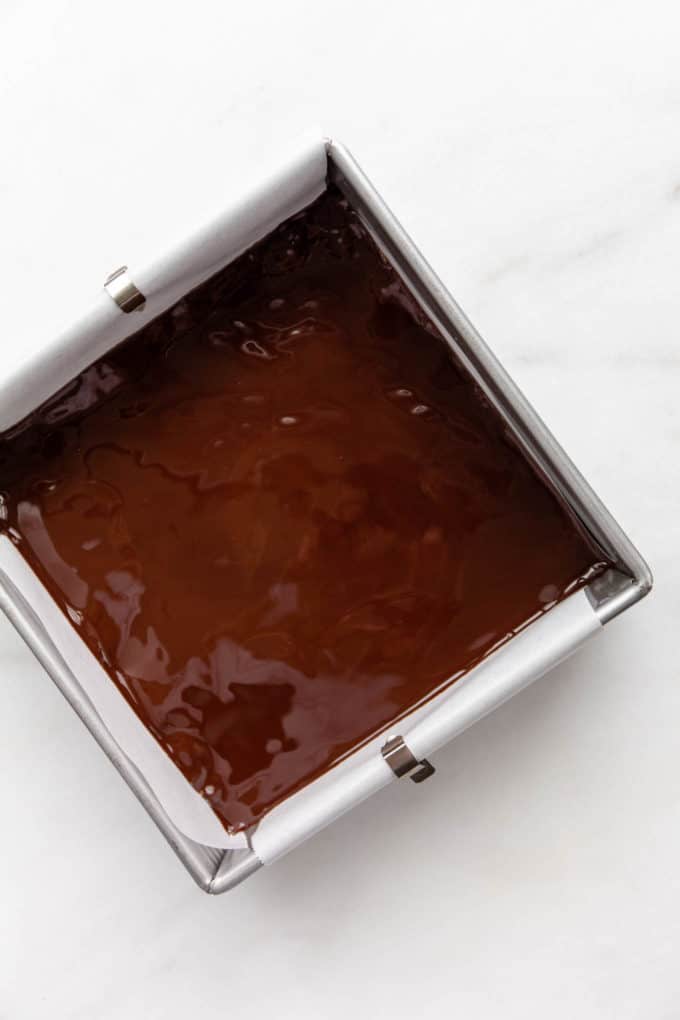 melted chocolate in an 8x8 inch pan
