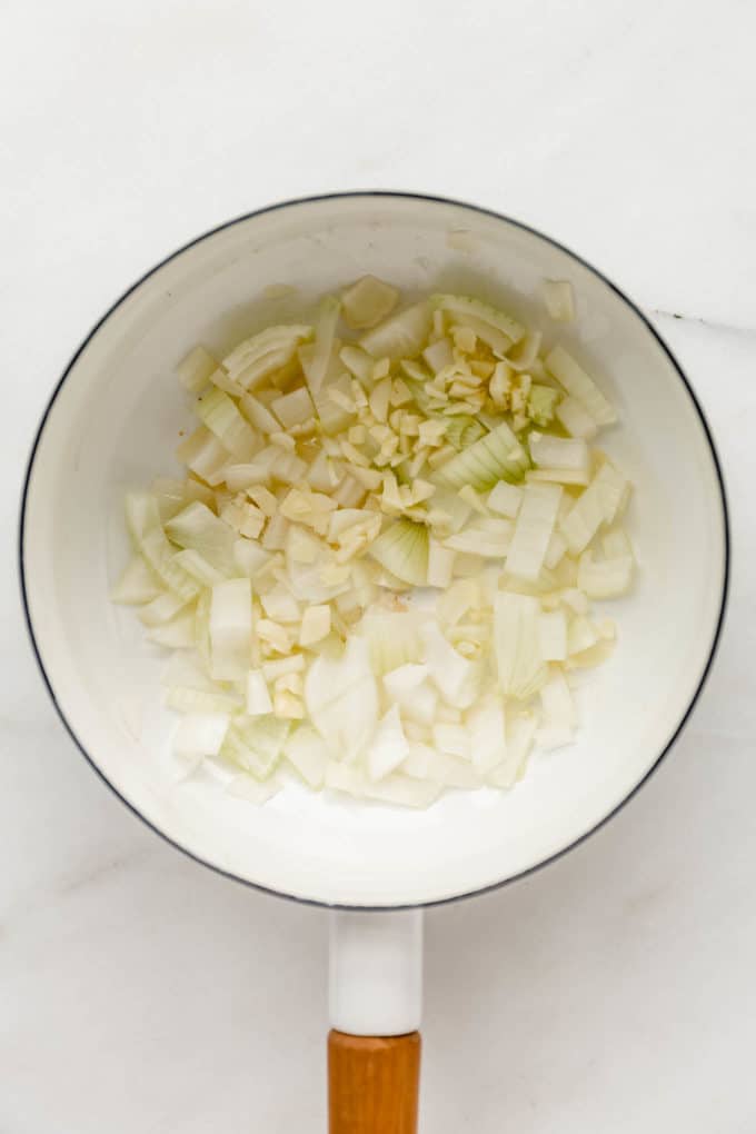 Onion and garlic in a white pot