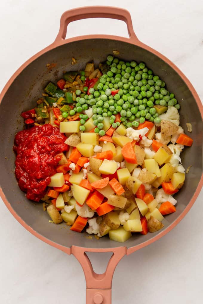 vegetables and crushed tomatoes in a pin pan