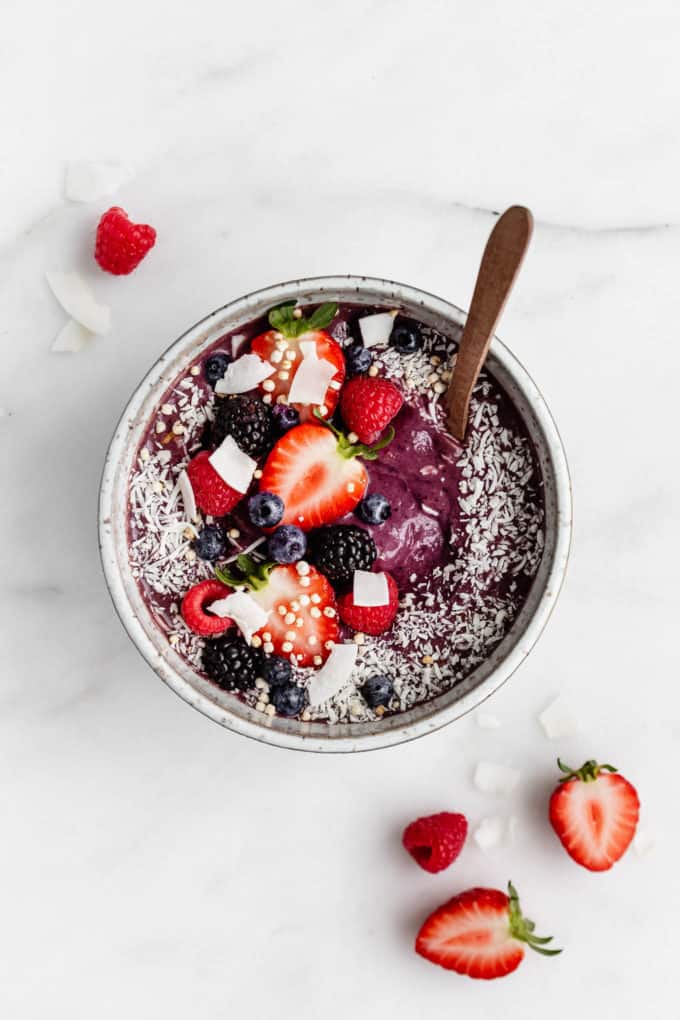 Acai smoothie bowl with berries and shredded coconut