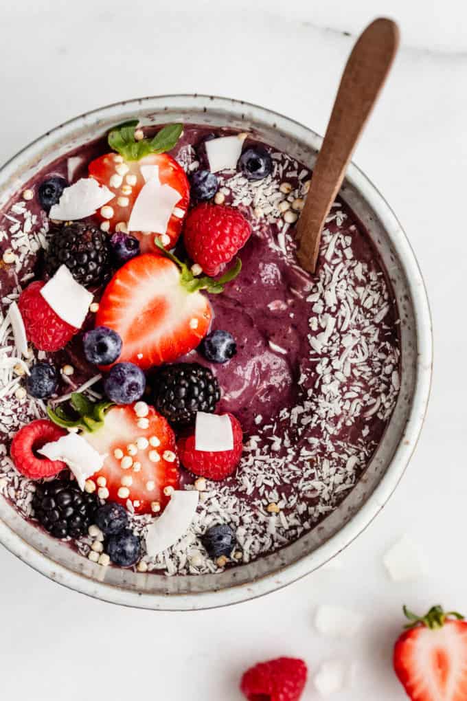 An acai bowl topped with berries