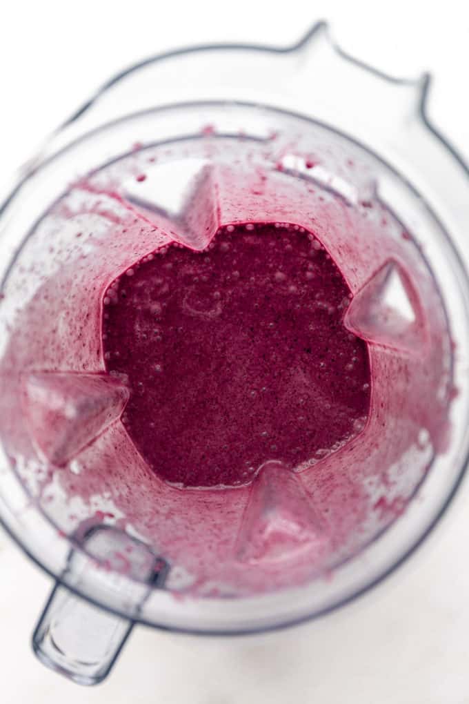 a blueberry spinach smoothie in a blender