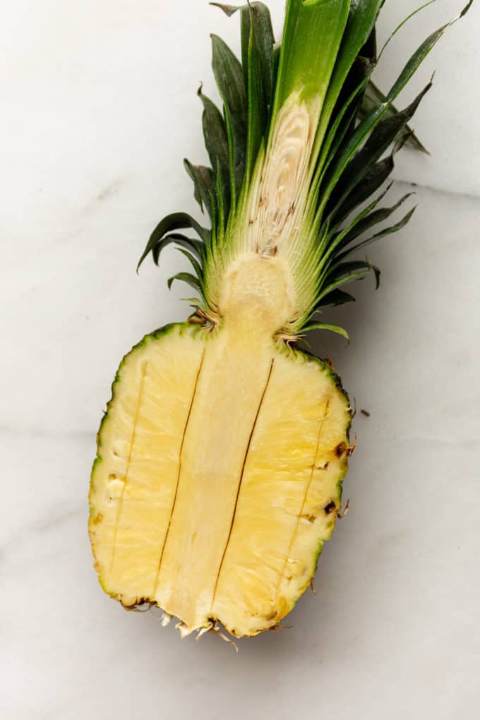 a pineapple with lengthwise cuts