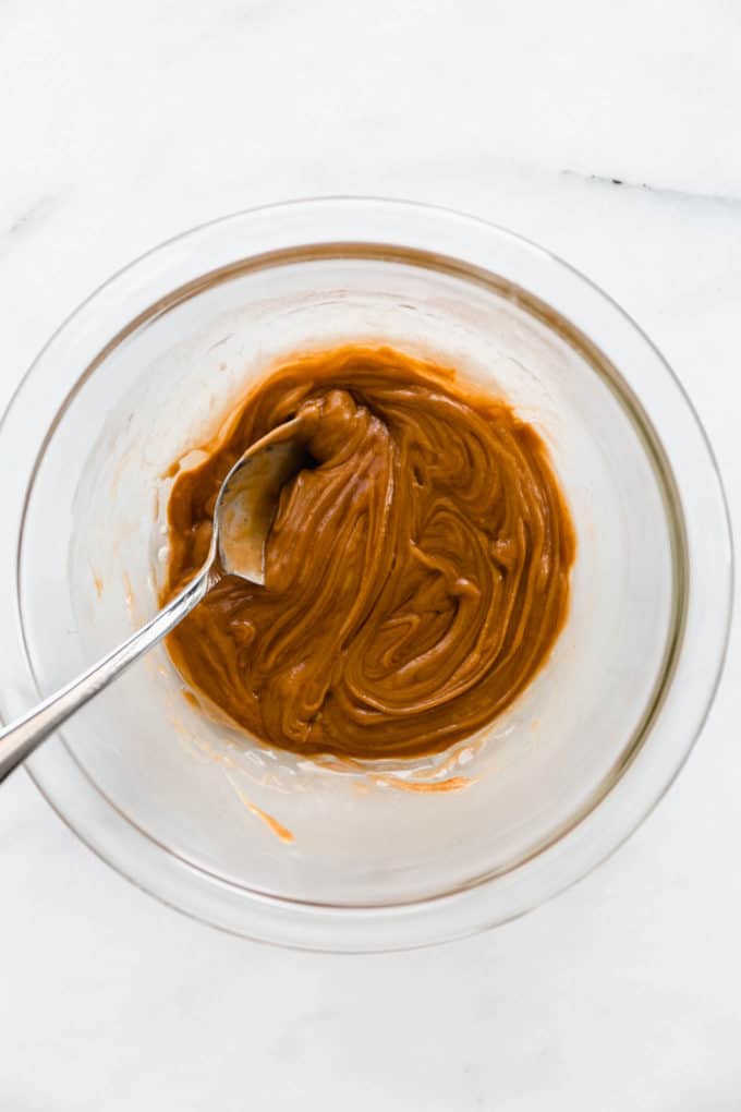 mixed peanut butter, honey and vanilla in a mixing bowl