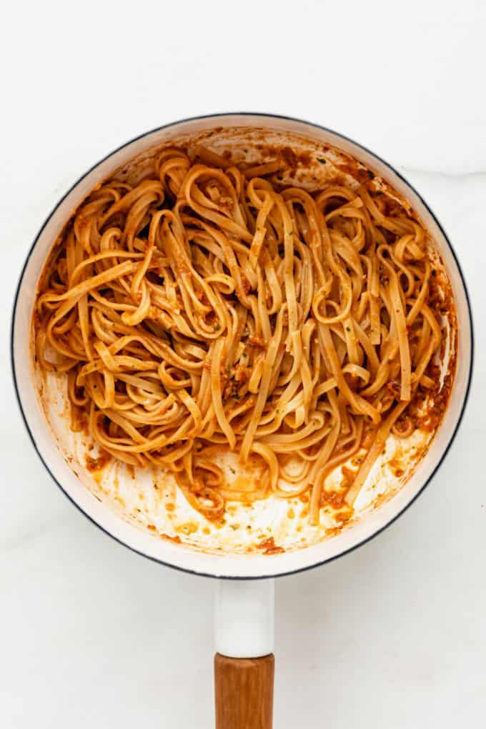 red pesto pasta in a white pot