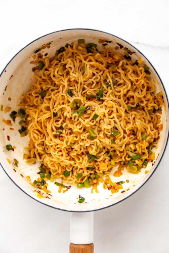 A pot of chili oil noodles with green onions