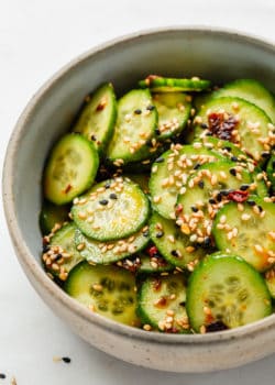 Asian cucumber salad topped with sesame seeds