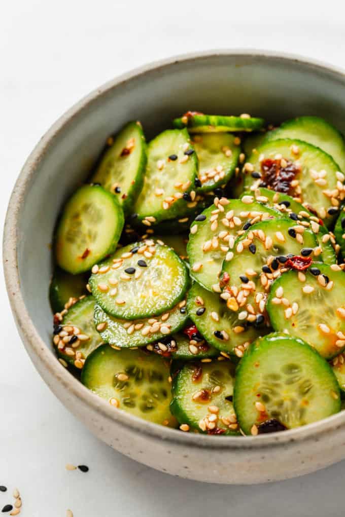 Asian cucumber salad topped with sesame seeds