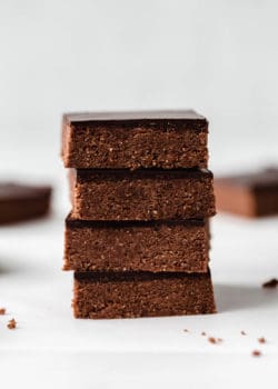 four chocolate protein bars stacked