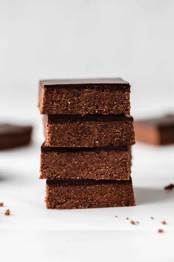 four chocolate protein bars stacked